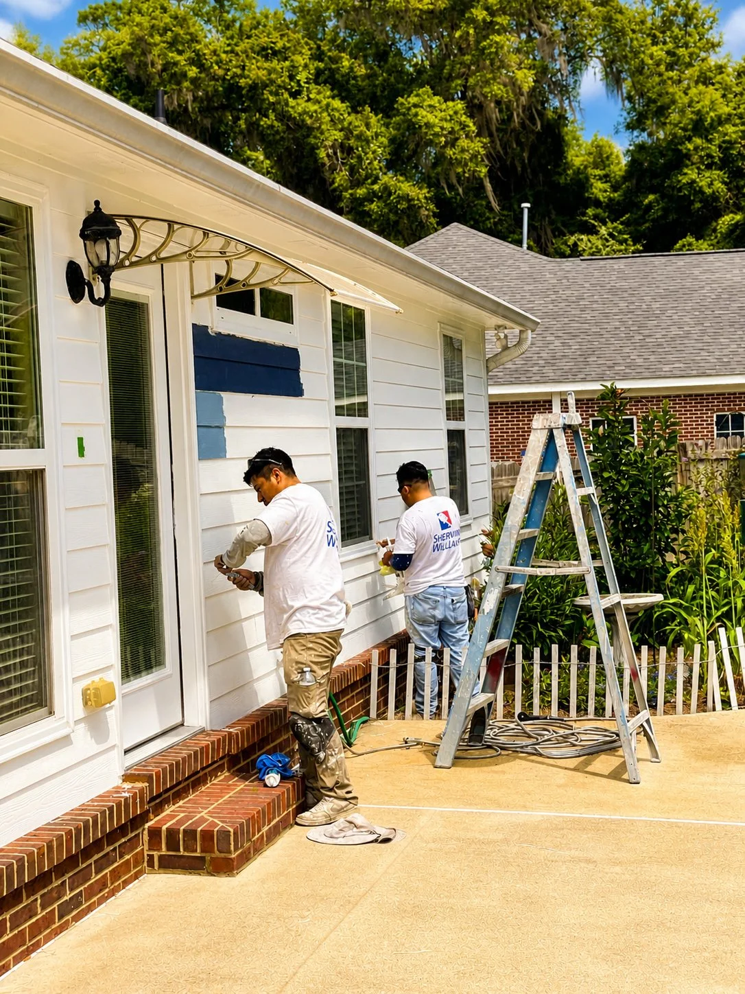 Seminole Ventures Painting crew working on exterior repaint in Tallahassee FL